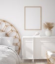 Mockup frame in Coastal boho style bedroom interior Royalty Free Stock Photo