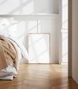 Mockup frame in light cozy and simple bedroom interior background Royalty Free Stock Photo