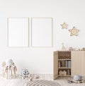 Mockup frame in minimal unisex child bedroom with natural wooden furniture