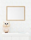 Mockup frame in minimal unisex child bedroom with natural wooden furniture Royalty Free Stock Photo