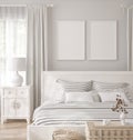 Mockup frame in white cozy bedroom interior background