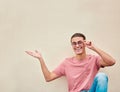 Mockup, hands and portrait of man pointing to space for advertising, empty and studio wall background. Face, hand