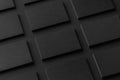 Mockup of horizontal business cards stacks arranged in rows at black textured paper background