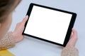 Mockup image of digital tablet computer with white blank screen in woman hands Royalty Free Stock Photo