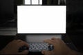 Mockup image of hands using laptop with blank white screen on a black background. programmer\'s work at night Royalty Free Stock Photo