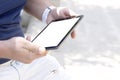 Mockup image screen tablet. Men hand holding texting using tablet at desk, with copy space, white blank space for advertise text. Royalty Free Stock Photo