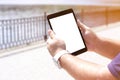 Mockup image screen tablet. Men hand holding texting using tablet at desk, with copy space, white blank space for advertise text. Royalty Free Stock Photo