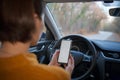 Mockup image of a woman holding and using mobile phone