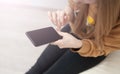 Mockup image of woman`s hands holding black mobile phone with blank screen in office Royalty Free Stock Photo