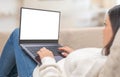 Mockup laptop. Close up of female sit on cozy sofa typing on laptop, woman freelancer working at computer from home. Laptop Royalty Free Stock Photo