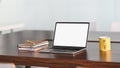 Mockup laptop computer isolated white screen on meeting room. Royalty Free Stock Photo