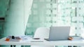 Mockup laptop on desk table with stack of paper and document Royalty Free Stock Photo