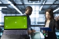 Mockup laptop in front of data center workers calibrating energy usage Royalty Free Stock Photo