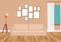 Mockup living room interior in hipster style with frames, sofa, lamp, concrete wall and parquet flooring. Loft design. Royalty Free Stock Photo