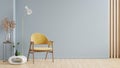 Mockup living room interior with yellow armchair on empty blue color wall background Royalty Free Stock Photo