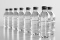 mockup of lot transparent full plastic bottles with mineral water on white isolated background. Blank template for Royalty Free Stock Photo