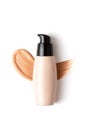 Mockup with make up face foundation bottle and smudged drop of concealer over the white background