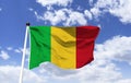 Mockup of Mali Flag fluttering under blue sky Royalty Free Stock Photo