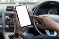 Mockup of man driver hand using blank white screen mobile smart phone inside a car, searching location via gps navigator Royalty Free Stock Photo