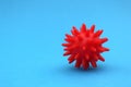 Red mock-up of coronavirus on a blue background with place for text.