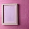 Mockup. Empty picture frame against pastel background. Royalty Free Stock Photo
