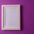 Mockup. Empty picture frame against pastel background. Royalty Free Stock Photo