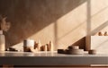 Mockup of modern empty brown concrete tabletop with bathroom decor in sunlight, stucco wall texture