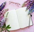 Mockup notebook with lupine flowers Royalty Free Stock Photo