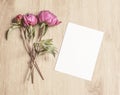 Mockup With Peony Flowers And A Vertical Card On Wooden Background