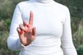 Mockup photo for woman pressing something with her index finger. Hand with a raised finger as an attention gesture Royalty Free Stock Photo