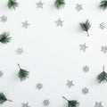 Mockup with pine branch, silver snowflake and star over white