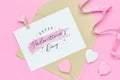 Mockup postcard and envelope on pink background with Happy valentines day, handy craft and pen. Mock up for elegant design. Flat Royalty Free Stock Photo