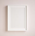 Mockup poster frame close up on wall painted pastel pink color