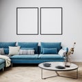 Mockup poster in modern living room interior in bright colors, blue sofa with coffee table. 3D rendering