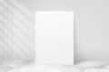 Mockup poster with shadow blinds from window. Mock up sheet paper. White empty blank. Vertical mockup. Light from window. Realisti