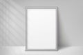 Mockup silver frame photo. Shadow on wall. Mock up artwork picture framed. Vertical boarder. Empty board a4 photoframe. Modern pla