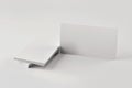 Mockup of a stack of blank business cards on a gray table close up Royalty Free Stock Photo