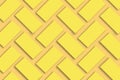 Mockup of stacks of gold business cards arranged in rows on a yellow textured paper background