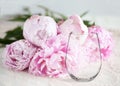 Mockup - stemless wine glass, with peonies behind