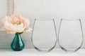 Mockup - stemless wine glasses, peony in a vase Royalty Free Stock Photo