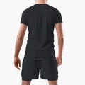 Mockup of stylish tracksuit, black shorts with compression line, t-shirt, on man, back view, isolated on background