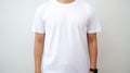 Mockup template of a man in a white t shirt for print design studio on isolated white wall