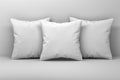 Mockup of three large white pillows