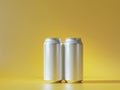 Mockup of Two Empty Aluminum White Drink Cans on Bright Yellow Background. Royalty Free Stock Photo