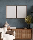 Mockup two poster frames in modern interior, blue room with beige chair, blue plaster wall, decoration and flowers, 3d render