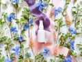 Mockup of unbranded white plastic spray bottle, blue and pink flowers and silk ribbons on white table. Bottle for branding and