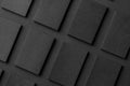 Mockup of vertical business cards stacks arranged in rows at black textured paper background