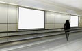 Mockup visual for advertising billboard display: person walking on moving walkway travelator in generic mrt train station. Blank Royalty Free Stock Photo