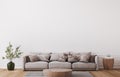 Mockup wall in farmhouse living room interior, beige sofa on white wall background Royalty Free Stock Photo