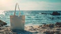 Mockup of white blank canvas tote bag with sea landscape on background, eco textile shopping sack with copy space, AI Royalty Free Stock Photo